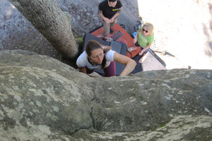 Katie Rendall bouldering with Pongoose in Fontainbleau, France.