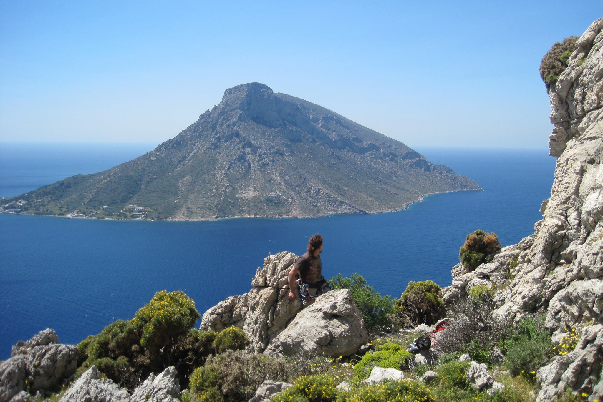 Pongoose founder Rob Rendall pictured in Kalymnos, Greece, in the sun with Telendos island and sea in background.