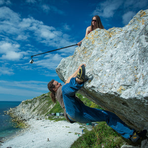 Pongoose founder Rob Rendall bouldering at Portland, Dorset, and being filmed using the Pongoose Climber 700 as a camera boom.