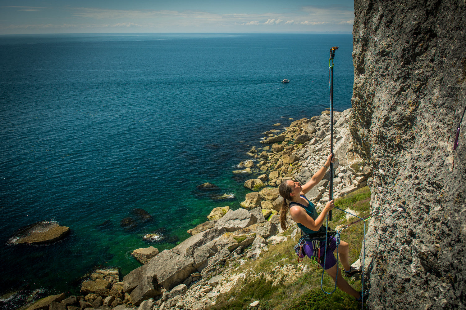 The Pongoose Climber 700 in use as a clipstick at Blacknor, Portland, UK, clipping a quickdraw into a bolt on a route image